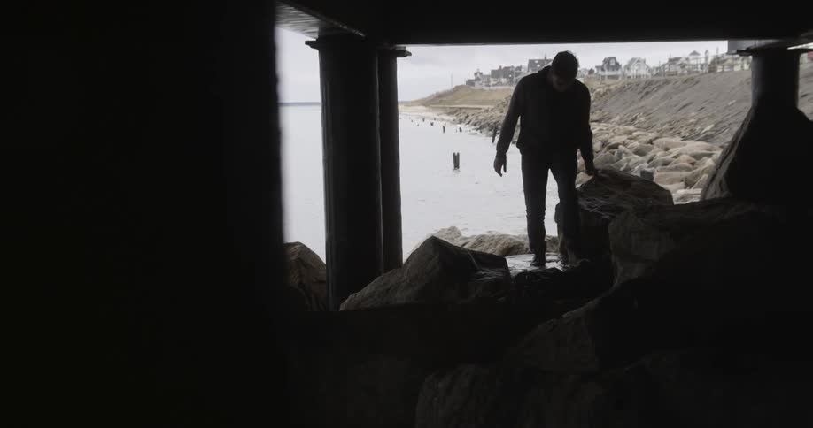 A man is walking into a building