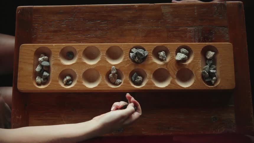 A woman plays a tabletop game