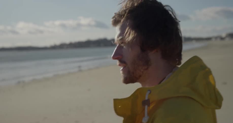 A man plays on the beach