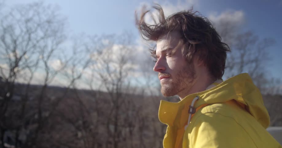 A man stands in the wind