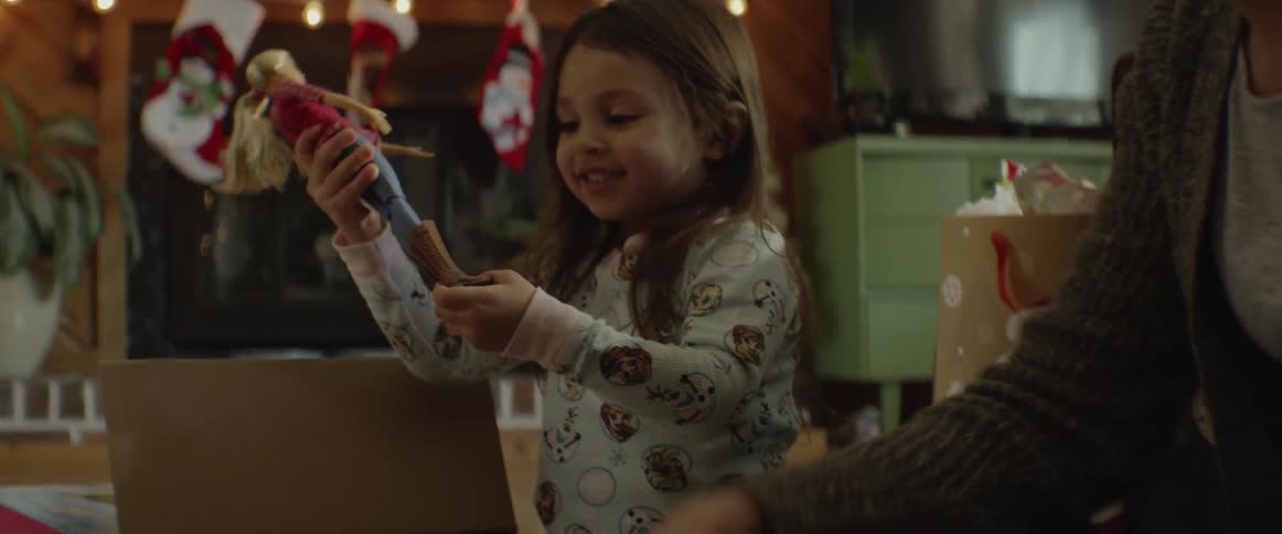Child and woman play with dolls