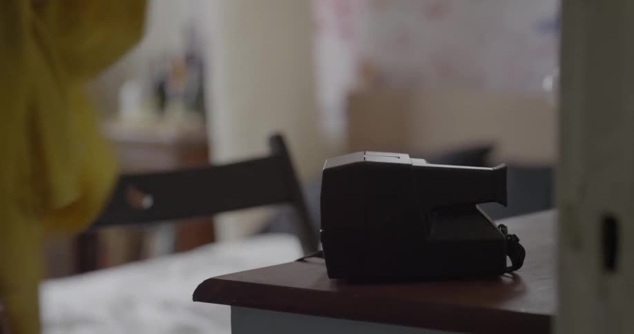 A camera rests on a table