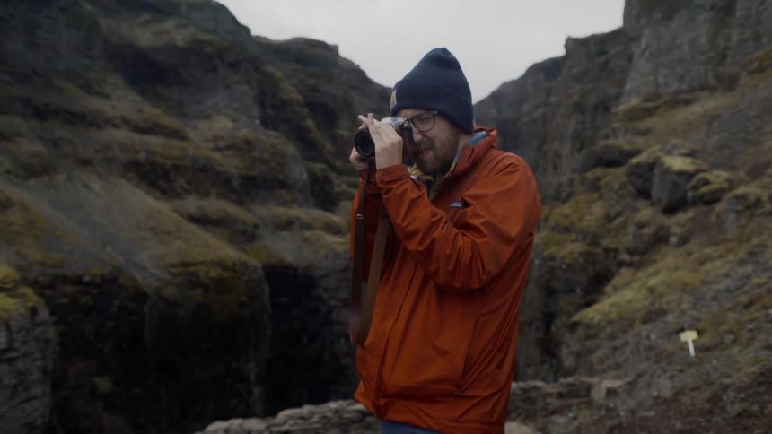 A man takes photographs of nature
