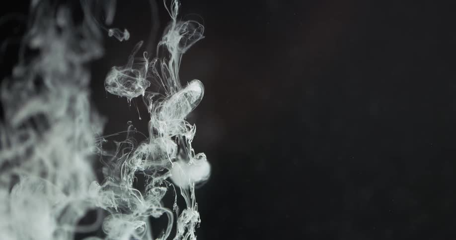 A white substance drops into liquid