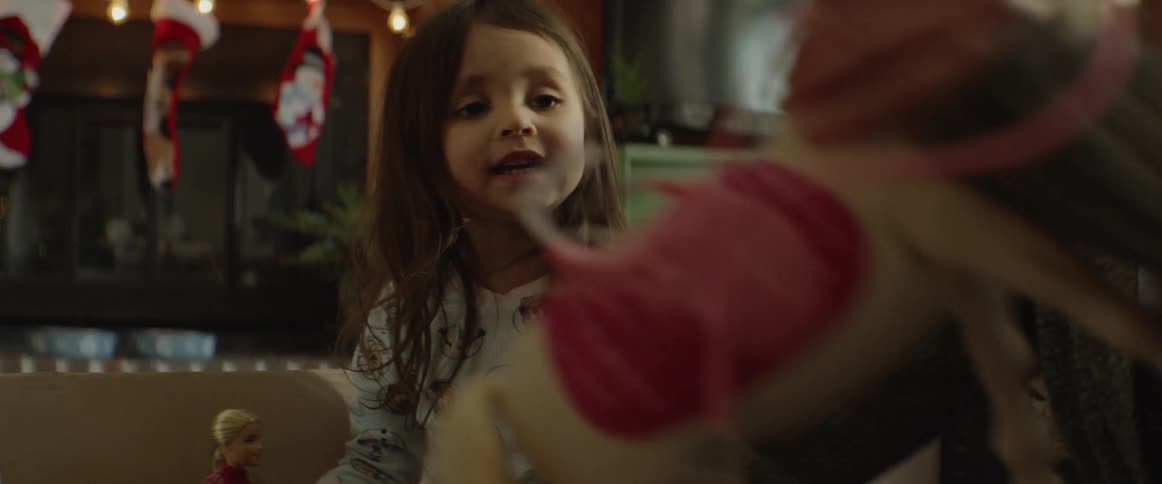 Child and woman play with dolls