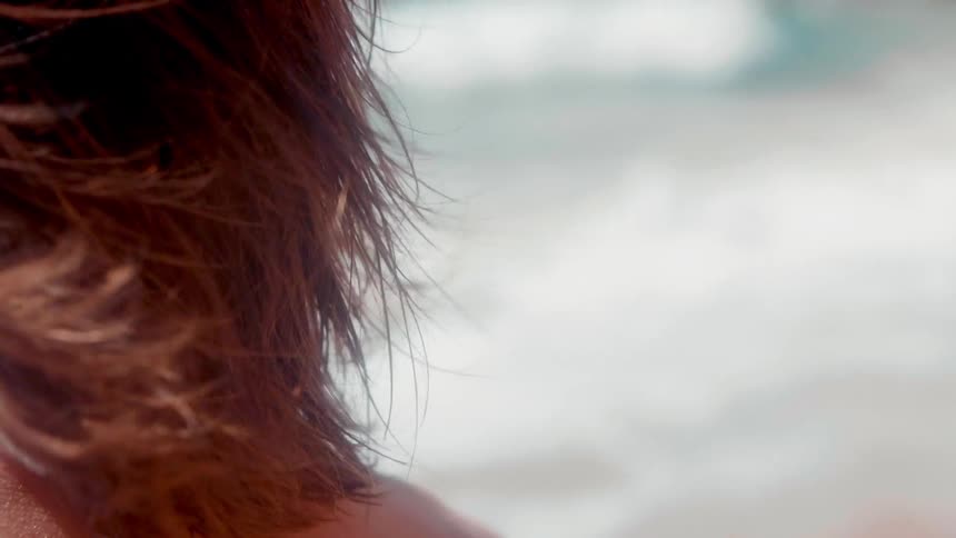 A woman's hair blows in the breeze