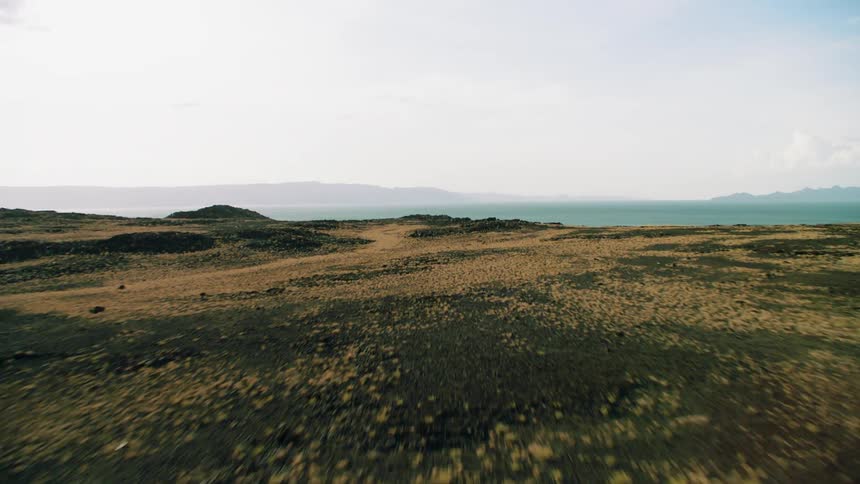 Grassy hilly land on a sunny day