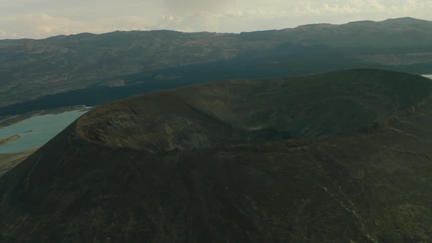 Crater in large mountain on cloudy day