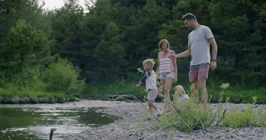 A family are enjoying a summer day in a natural setting