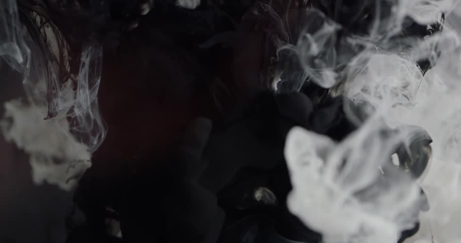 White and black liquid mix together