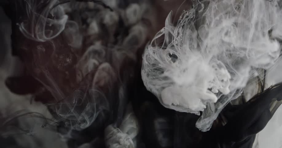 Clouds of dye float and blend in liquid