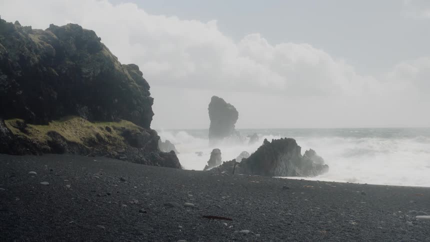 Ocean waves crash onto the rocky shore