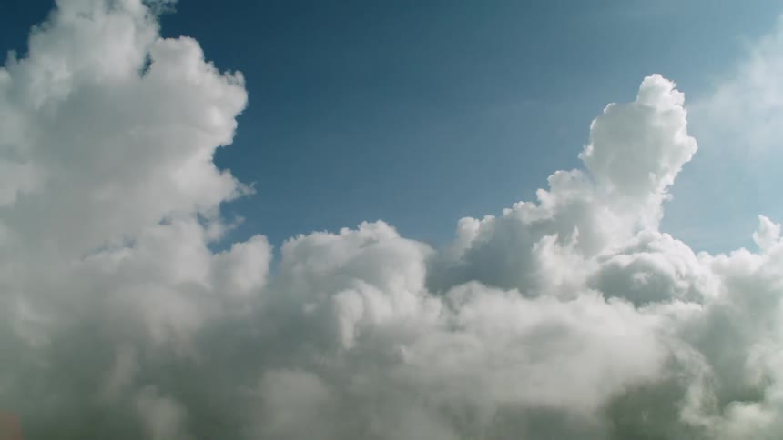 Clouds passing in the sky on a sunny day