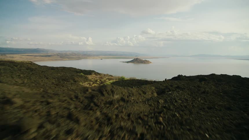 Grassy plains and a large body of water