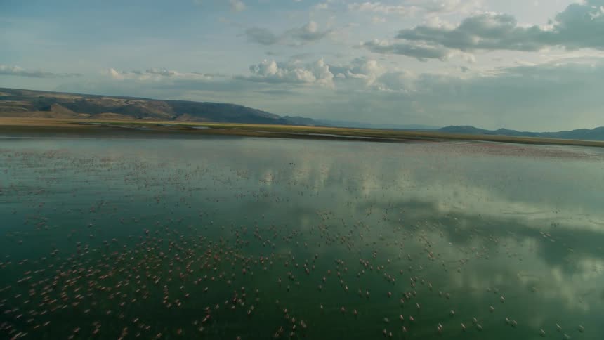 Reflections of clouds on smooth lake water