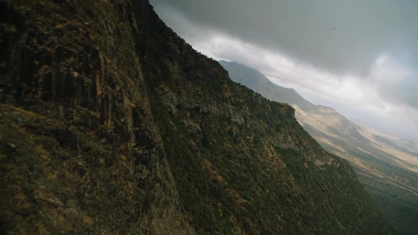 Clouds hanging over mountains and vast wilderness
