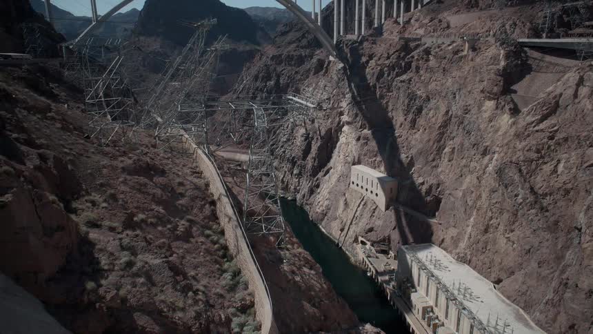 A bridge stretches across a water dam