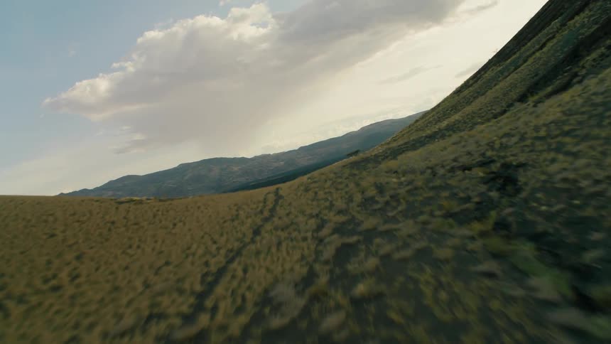 Bodies of water flow in valleys between hills