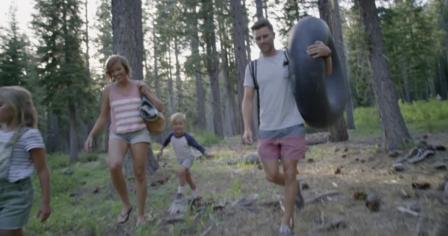 A family travel through the forest together