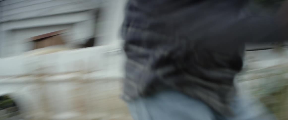 Someone is sprinting down an alley