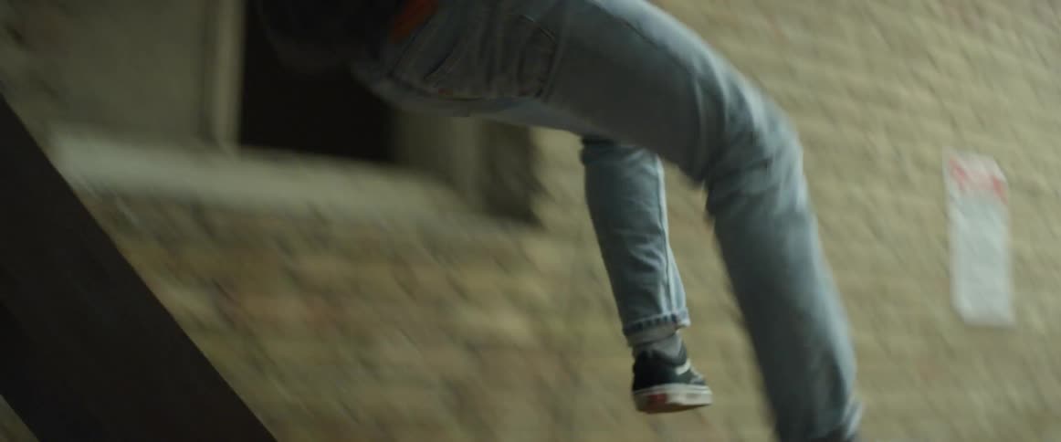 Man running down and jumping off outside stairway