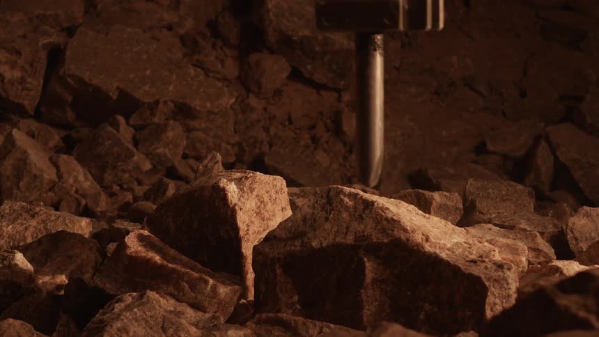 Equipment drills through rock and breaks it up