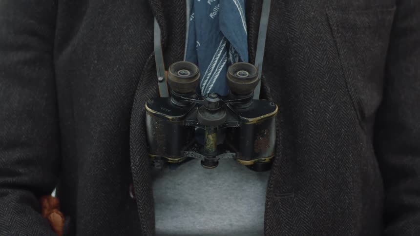 Person wearing a camera on a strap