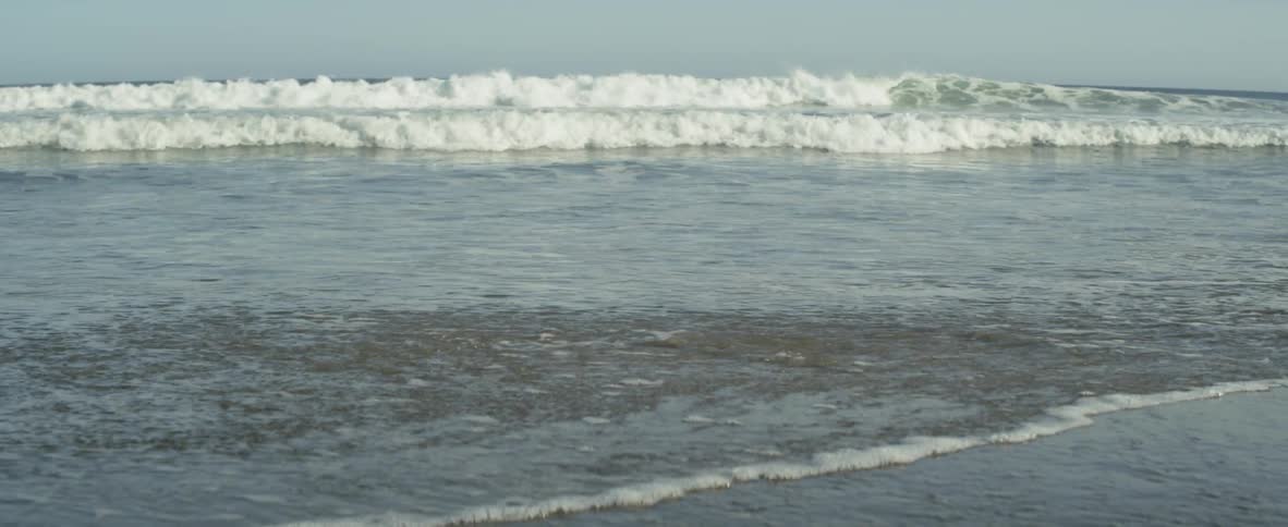 Ocean waves flow onto the shore