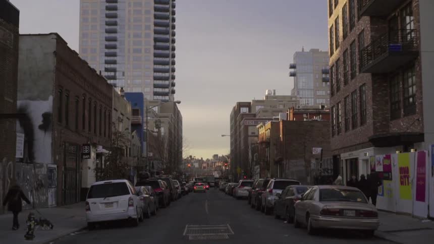 A bus goes by a busy street