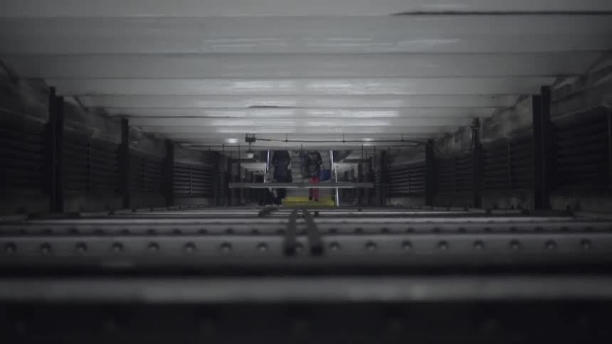 People walking down stairs in a large building