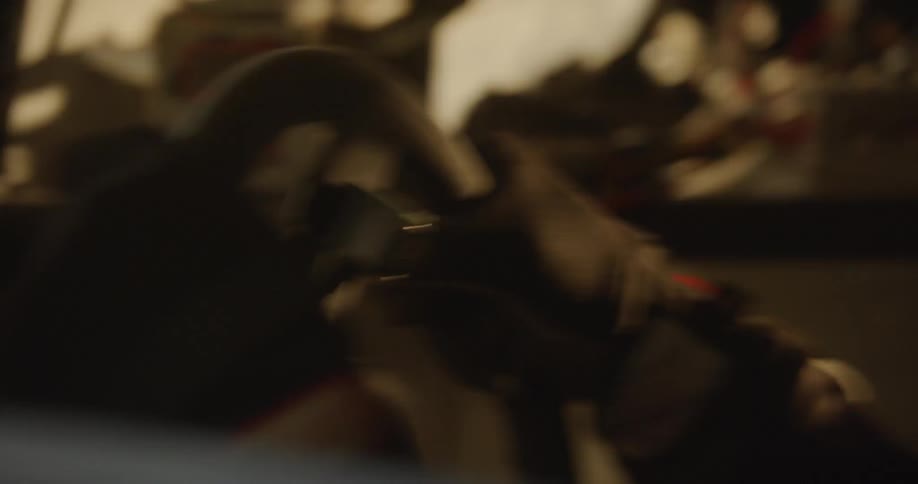 Person grips onto the steering wheel of a vehicle