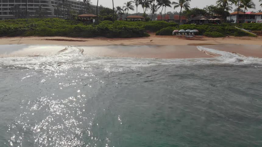 Waves crash onto the shore