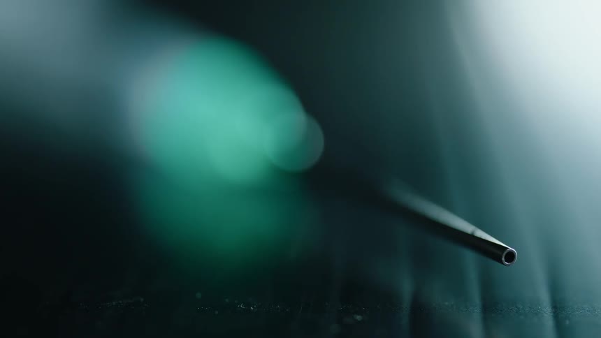 Needle of a syringe on a table