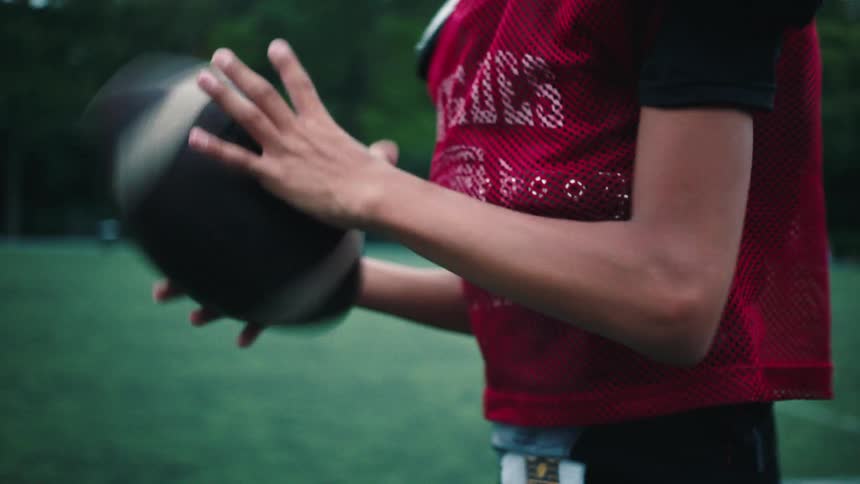 A young football player gets ready to throw a ball
