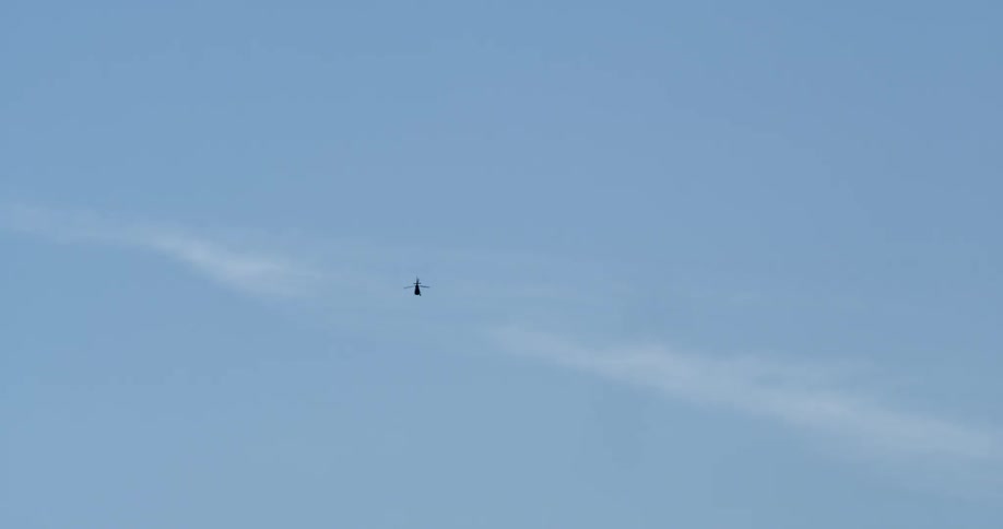 A helicopter flies in the sky