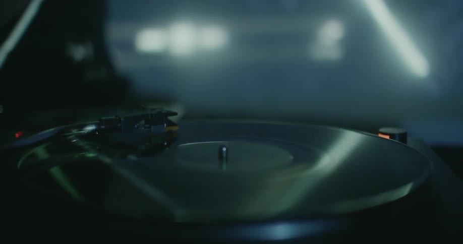 Record spins on a turntable in a nightclub