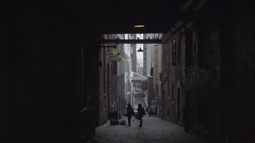 People standing in a city alley