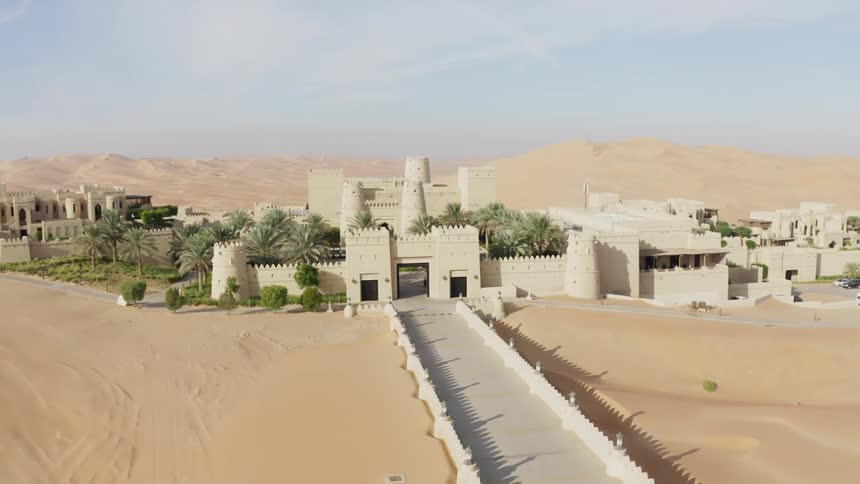 Buildings sit in the middle of a desert