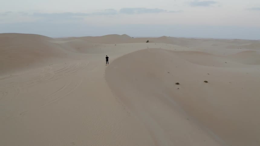 A person hikes in the desert