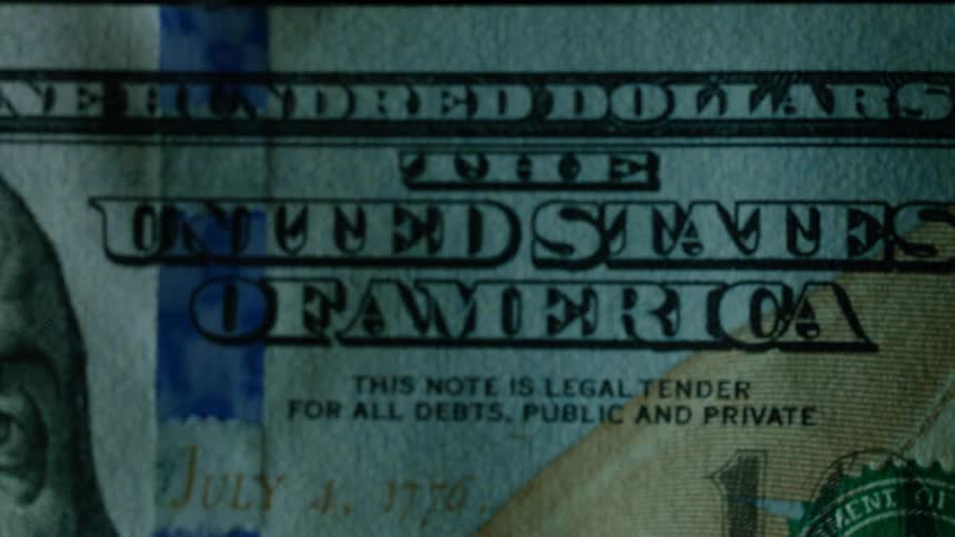One hundred american dollar bill with a purple streak