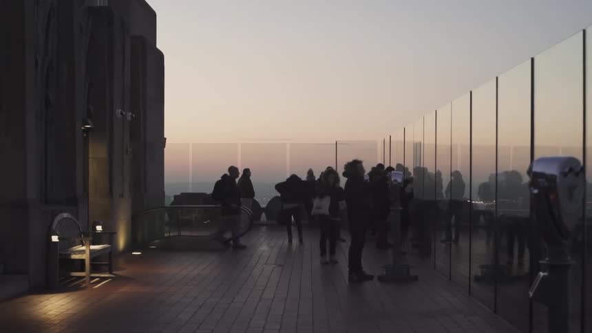 People gather on the deck of an observatory