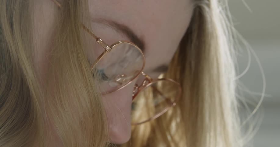 Artist Student wears glasses while concentrating