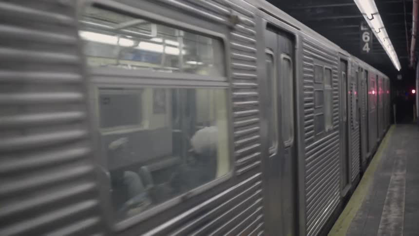 Close view of a subway leaving the station