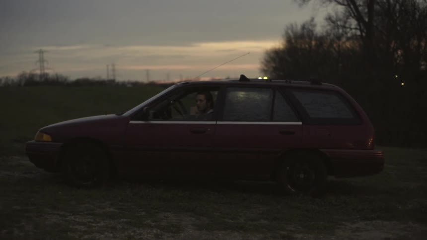 A man sitting in a car