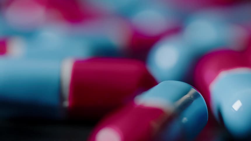 Red and blue pills in a pile