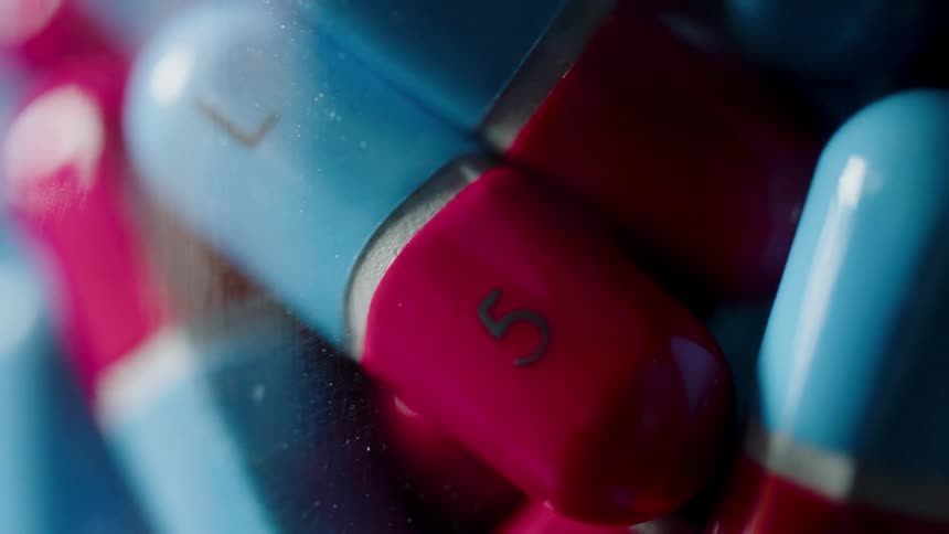 Red and blue pills in a pile