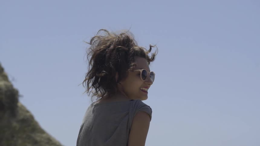 A woman is wearing sunglasses