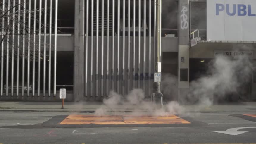 Steaming grate on a city street