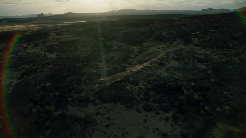 The sun shines over a rural landscape