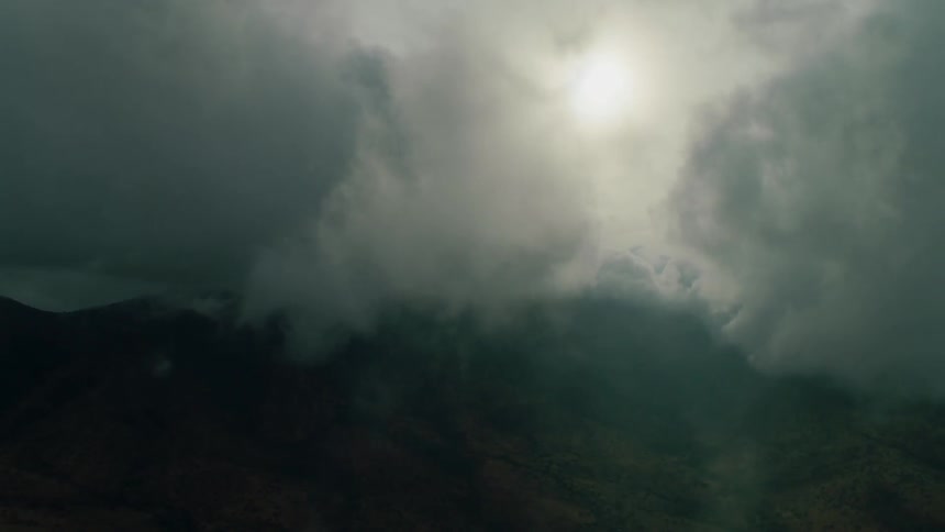 Clouds float above a mountain range